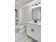 Bathroom featuring a single sink vanity, marble floors, and modern black accents at 474 Maxwell Rd, Roswell, GA 30075