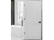 Detail shot of a modern bathroom featuring a white door, soaking tub and brushed nickel fixtures at 474 Maxwell Rd, Roswell, GA 30075