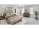 Bedroom with neutral tones, with ensuite bathroom and ample natural light at 474 Maxwell Rd, Roswell, GA 30075
