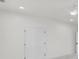A bright bedroom with white walls, carpet, and a ceiling fan at 474 Maxwell Rd, Roswell, GA 30075