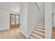 Inviting entryway with light wood floors and staircase, leading to the upper level at 474 Maxwell Rd, Roswell, GA 30075