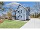 Beautiful exterior featuring blue siding, a driveway, and a well-maintained lawn at 474 Maxwell Rd, Roswell, GA 30075