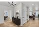 Bright foyer with hardwood floors, modern lighting, and an elegant console table at 474 Maxwell Rd, Roswell, GA 30075