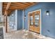Beautiful front porch featuring a wooden beam ceiling and a stylish front door at 474 Maxwell Rd, Roswell, GA 30075