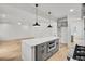 Modern kitchen with a white island, gray cabinets, stainless steel appliances, and bright white tile backsplash at 474 Maxwell Rd, Roswell, GA 30075
