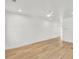 A simple open room featuring a white ceiling fan and light colored hardwood floors at 474 Maxwell Rd, Roswell, GA 30075
