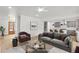 Open living room with a view of the kitchen, hardwood floors, and neutral paint at 474 Maxwell Rd, Roswell, GA 30075