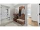 Mudroom with woodgrain hall tree, storage bench, and access to the bathroom and another room at 474 Maxwell Rd, Roswell, GA 30075