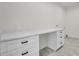 Office features a large white desk, drawers, and stylish tiled flooring at 474 Maxwell Rd, Roswell, GA 30075