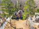 Aerial shot of a home with a manicured yard, mature trees, and driveway at 1290 Regency Center Sw Dr, Atlanta, GA 30331