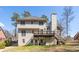 Spacious home featuring a back deck, chimney, and a staircase to the yard at 1290 Regency Center Sw Dr, Atlanta, GA 30331