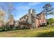Expansive backyard featuring a deck with stairs leading down to the patio and lawn at 1290 Regency Center Sw Dr, Atlanta, GA 30331