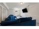 A basement media room with a large sectional sofa and a TV at 1290 Regency Center Sw Dr, Atlanta, GA 30331