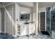 An elegant bathroom features a vessel sink, white cabinetry, and a glass enclosed shower at 1290 Regency Center Sw Dr, Atlanta, GA 30331