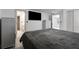 A spacious bedroom with a large bed, two dressers, and an ensuite bathroom at 1290 Regency Center Sw Dr, Atlanta, GA 30331