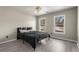 Bedroom with neutral walls, two bright windows and a ceiling fan at 1290 Regency Center Sw Dr, Atlanta, GA 30331