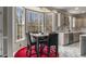 Cozy dining area features a bay window, an exquisite light fixture, and a red accent rug at 1290 Regency Center Sw Dr, Atlanta, GA 30331