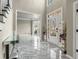 Elegant foyer featuring marble floors, decorative door and staircase at 1290 Regency Center Sw Dr, Atlanta, GA 30331