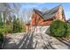 The exterior features a three car garage at 1290 Regency Center Sw Dr, Atlanta, GA 30331