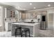 Modern kitchen featuring a cooktop island, seating, and stainless-steel refrigerator at 1290 Regency Center Sw Dr, Atlanta, GA 30331