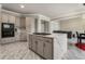 Open concept kitchen with island, stone countertops, stainless appliances and eat-in dining area at 1290 Regency Center Sw Dr, Atlanta, GA 30331