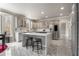 Modern kitchen featuring an island, seating, and stainless-steel refrigerator at 1290 Regency Center Sw Dr, Atlanta, GA 30331