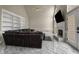 Open living room with built-in shelving, fireplace, and view of the backyard at 1290 Regency Center Sw Dr, Atlanta, GA 30331