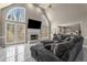 Open living room with fireplace, bright windows and vaulted ceilings at 1290 Regency Center Sw Dr, Atlanta, GA 30331