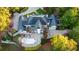 Expansive home featuring an in-ground pool, multi-level deck, and ample parking nestled amongst beautiful trees at 1806 Wynthrop Manor Sw Dr, Marietta, GA 30064