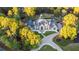 Expansive estate nestled among mature trees, featuring a circular driveway and meticulously maintained grounds at 1806 Wynthrop Manor Sw Dr, Marietta, GA 30064