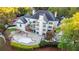 Backyard aerial view featuring a pool, deck, manicured landscaping, and ample space for outdoor entertaining at 1806 Wynthrop Manor Sw Dr, Marietta, GA 30064