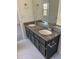 Bathroom with a double vanity featuring granite countertops and tile floors at 4155 Gables Pl, Buford, GA 30519