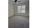 Bedroom with neutral carpet and large window for ample natural lighting at 4155 Gables Pl, Buford, GA 30519