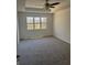 Bedroom with neutral carpet and large window for ample natural lighting at 4155 Gables Pl, Buford, GA 30519