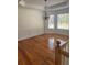Hardwood dining room with wainscoting, crown molding, and natural light from windows at 4155 Gables Pl, Buford, GA 30519