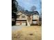 Charming two-story home with brick accents, a two-car garage, and manicured front yard, offering classic curb appeal at 4155 Gables Pl, Buford, GA 30519