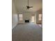Bright living room features a vaulted ceiling, fireplace, and neutral carpeting at 4155 Gables Pl, Buford, GA 30519