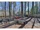 Large backyard with a hammock, bench, and mature trees at 5180 Cameron Forest Pkwy, Johns Creek, GA 30022