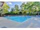 Inviting community pool surrounded by lush greenery, perfect for relaxation and recreation at 5180 Cameron Forest Pkwy, Johns Creek, GA 30022