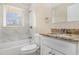 Bathroom featuring granite countertop, shower and tub, white vanity and neutral decor at 2867 Mitchell Dr, Decatur, GA 30032