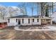 Charming single-story home featuring a covered carport and manicured front yard at 2867 Mitchell Dr, Decatur, GA 30032