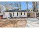Inviting one-story home showcasing a covered carport and freshly painted exterior at 2867 Mitchell Dr, Decatur, GA 30032