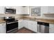 Updated kitchen featuring stainless steel appliances, granite countertops, and ample cabinet space at 2867 Mitchell Dr, Decatur, GA 30032