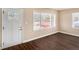 Cozy living room area with wood flooring and a well-lit entryway at 2867 Mitchell Dr, Decatur, GA 30032