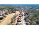 A high-angle shot reveals a home nestled among trees and other properties in a well-maintained neighborhood at 6026 Southland Dr, Stone Mountain, GA 30087