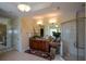 Well-lit bathroom features a granite countertop, cherry wood cabinets, and a glass-enclosed shower at 6026 Southland Dr, Stone Mountain, GA 30087