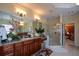 Spacious bathroom with granite-topped dark wood cabinets, a large mirror, and a glass-enclosed shower at 6026 Southland Dr, Stone Mountain, GA 30087