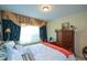 Charming bedroom with a window treatment, offering a relaxing space for rest and rejuvenation at 6026 Southland Dr, Stone Mountain, GA 30087