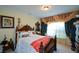 Comfortable bedroom with a decorative window treatment, offering a serene retreat for rest and relaxation at 6026 Southland Dr, Stone Mountain, GA 30087