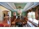 Elegant dining room featuring a chandelier, large table, and decorative window treatments at 6026 Southland Dr, Stone Mountain, GA 30087